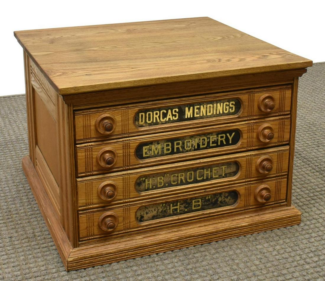 AMERICAN OAK COUNTERTOP FOUR-DRAWER SPOOL CABINET: American countertop oak spool cabinet, late 19th c., four drawers with stenciled insets, molded base, accompanied by (three) boxes of J & P Coats mending threads, approx 15.25"h, 21.5"w, 21.5"d **Prov