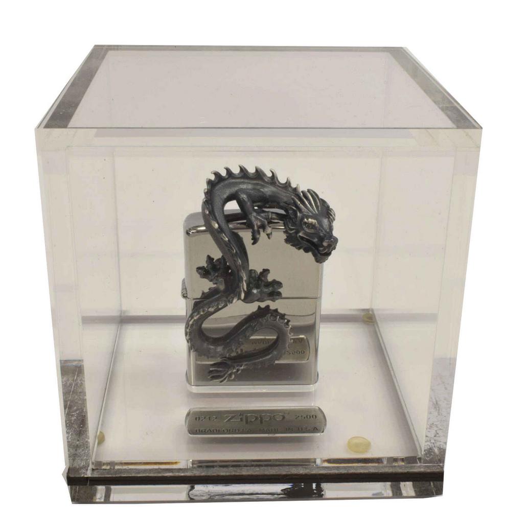 ZIPPO THREE-DIMENSIONAL DRAGON LIGHTER & DISPLAY: Zippo limited-edition three-dimensional dragon lighter, numbered 212 of 2500, housed in acrylic display cube, approx 4"h, 3.75"w, 3.75"d, 0.75lbs Start Price: $80.00