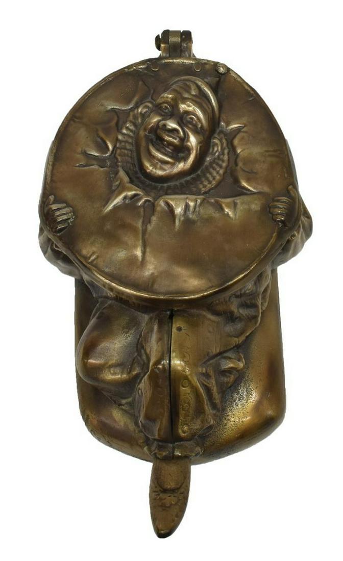CHAS HOFFMAN CHICAGO CIRCUS CLOWN TOBACCO SPITTOON: American Tobacciana cast steel circus clown spittoon, Chas. (Charles) Hoffman, Chicago, Illinois, in a bronze patina, foot-operated hinged lid, retaining interior insert, approx 5.5"h, 13.5"w, 8.5"d,