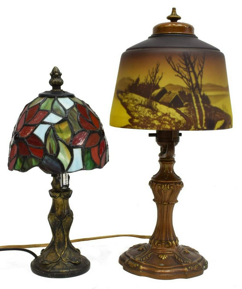 (2) REVERSE DECORATED & STAINED GLASS LAMPS: (lot of 2) Diminutive boudoir lamps, 20th c, including: (1) Tiffany style stained and leaded glass shade, concealing single light, central standard rising on circular foot, approx 11"h, 5.5"diam; (1) 
