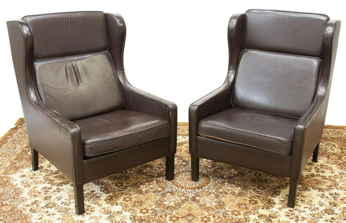 (2) MID-CENTURY BORGE MOGENSEN WINGBACK CHAIRS: (lot of 2) Danish mid-century modern wingback armchairs, attributed to Borge Mogensen (Danish, 1914-1972), c.1960s, chocolate brown leather upholstery, cushioned headrest, back and seat, rising on woo