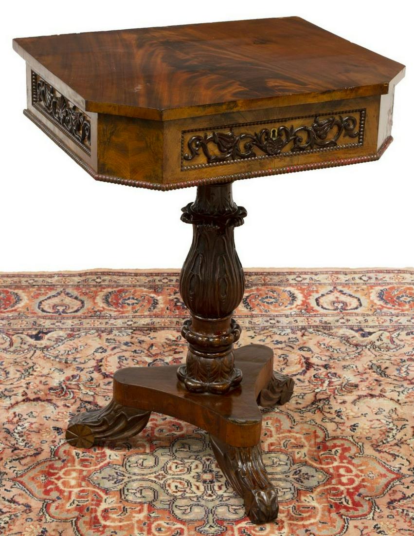 CONTINENTAL MAHOGANY FITTED SEWING STAND: Continental mahogany sewing stand, 19th c., hinged top opening to fitted interior with small compartments, foliate carved center pedestal, platform base further raised on three scrolled legs, approx 3