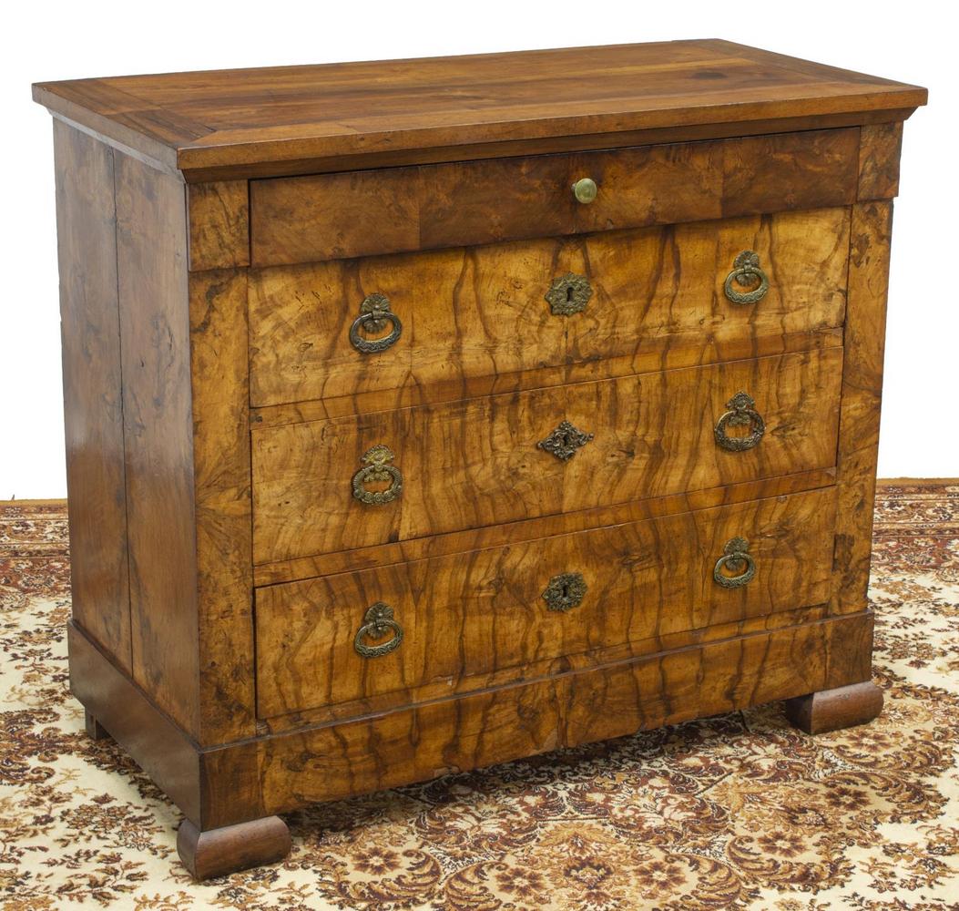 FRENCH LOUIS PHILIPPE PERIOD WALNUT COMMODE: French Louis Philippe period walnut commode, mid 19th c., having rectangular top, over single frieze drawer, three lower drawers, with elaborate foliate pulls and escutcheons, rising on bracket feet, 