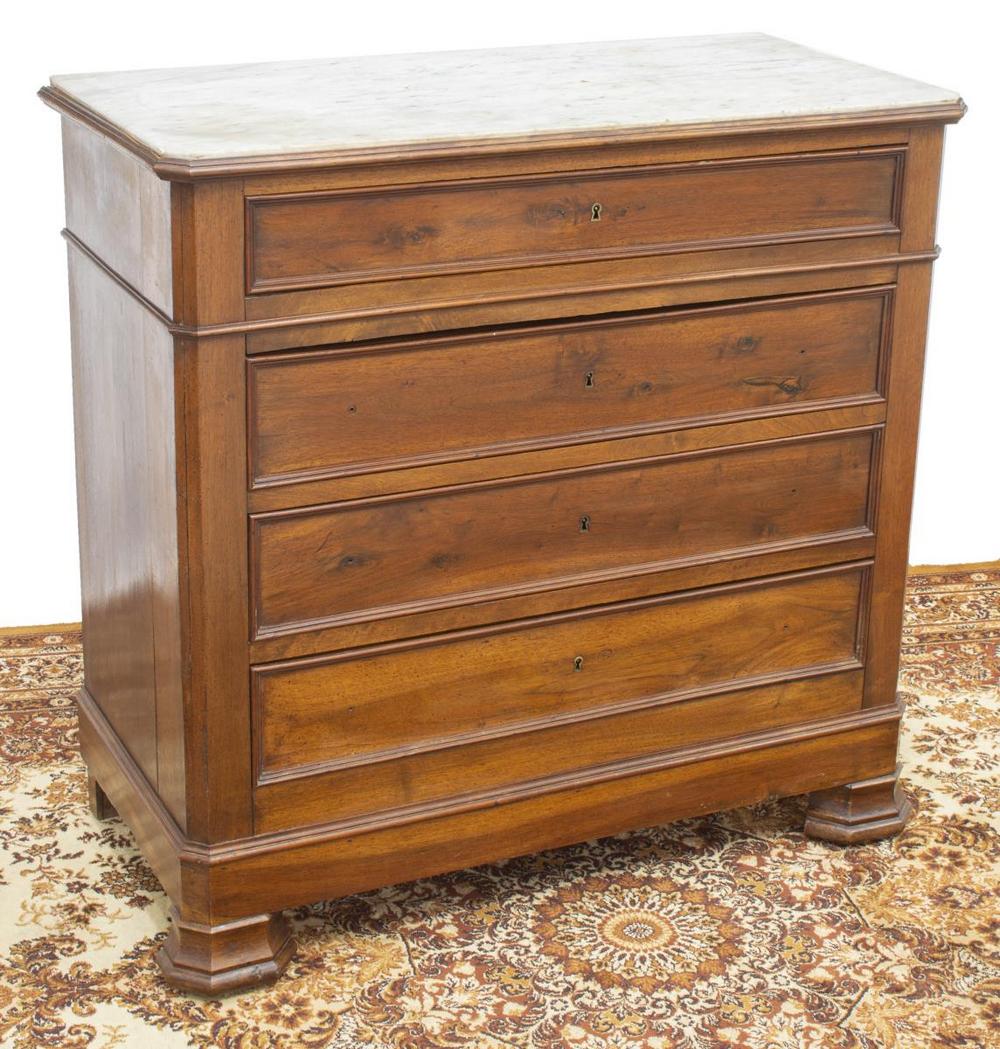 FRENCH LOUIS PHILIPPE MARBLE-TOP WALNUT COMMODE: French Louis Philippe period walnut commode, mid 19th c., canted rectangular marble top, case fitted with four drawers, stains and small chip to marble, split to right side panel, approx 39.5"h, 40.5"