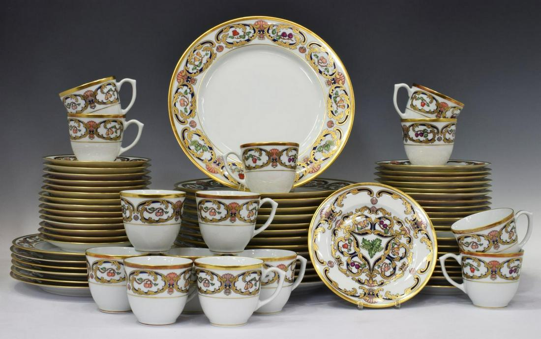 (69) CARTIER LIMOGES 'LA MAISON DU PRINCE' SERVICE: (lot of 69) Cartier Limoges dinner service, in the "La Maison du Prince" pattern, with gilt rim and foliates, polychrome scallops, varied fruit motifs, maker's mark underfoot, comprising: (14) dinner 