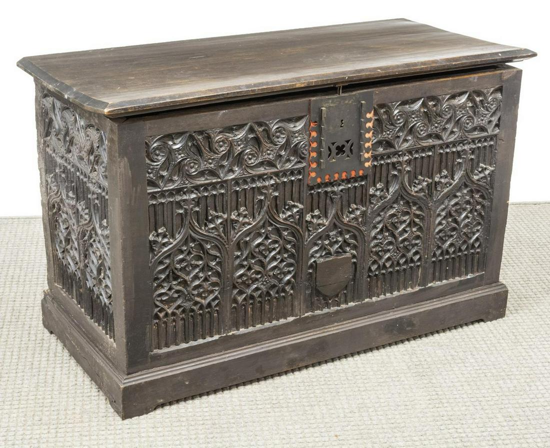 FRENCH GOTHIC REVIVAL CARVED TRACERY STORAGE TRUNK: French Gothic Revival carved storage trunk, 19th c., hinged rectangular top, opening to interior storage, with extensive carved arches and tracery, architectural and foliate ornamentation, pierced met