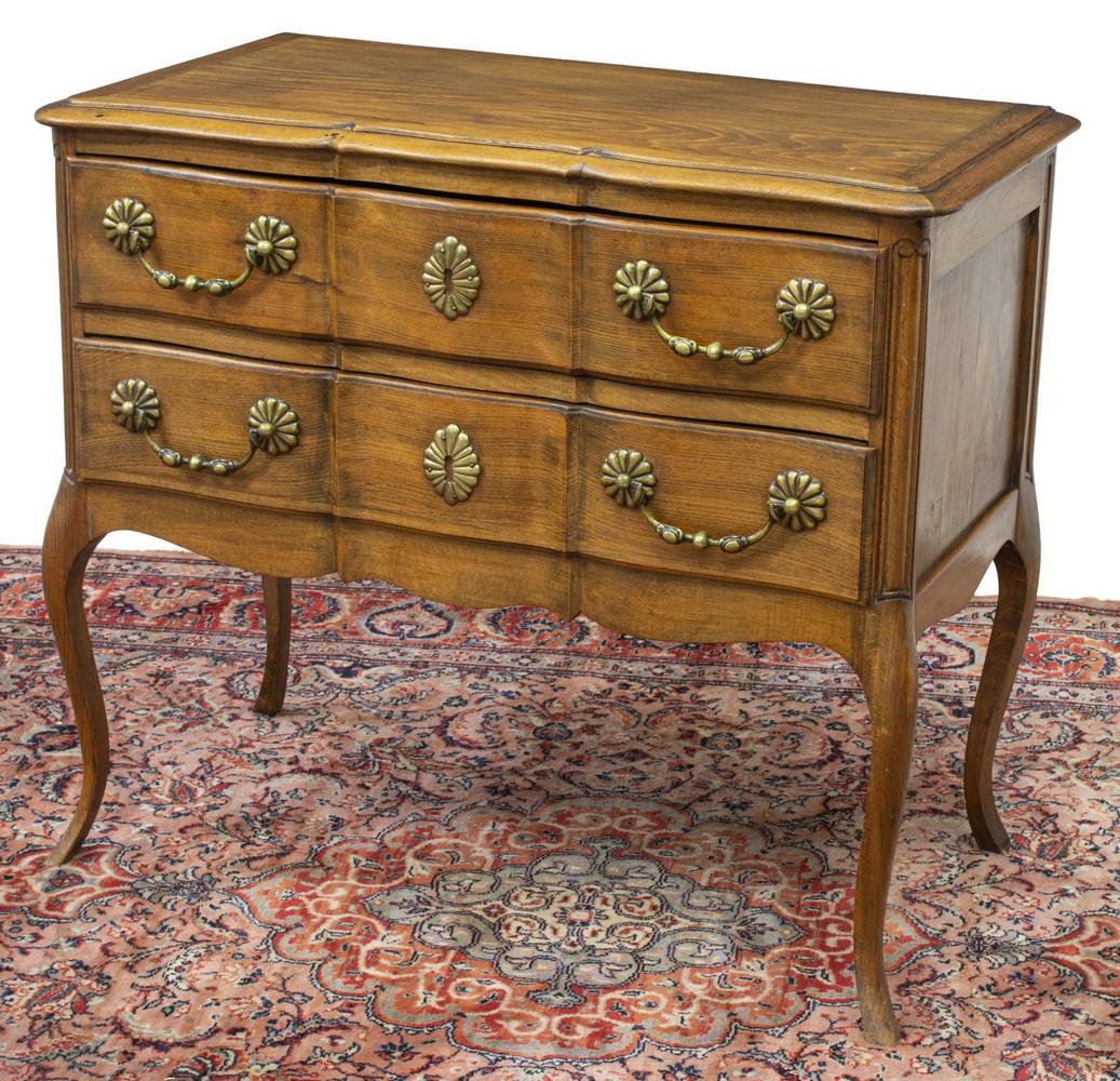 FRENCH LOUIS XV STYLE TWO-DRAWER COMMODE: French Louis XV style commode, early 20th c., having shaped rectangular top, over case fitted with two drawers, metal hanging pulls, scalloped escutcheon, rising on slim cabriole legs, approx 31"h, 36