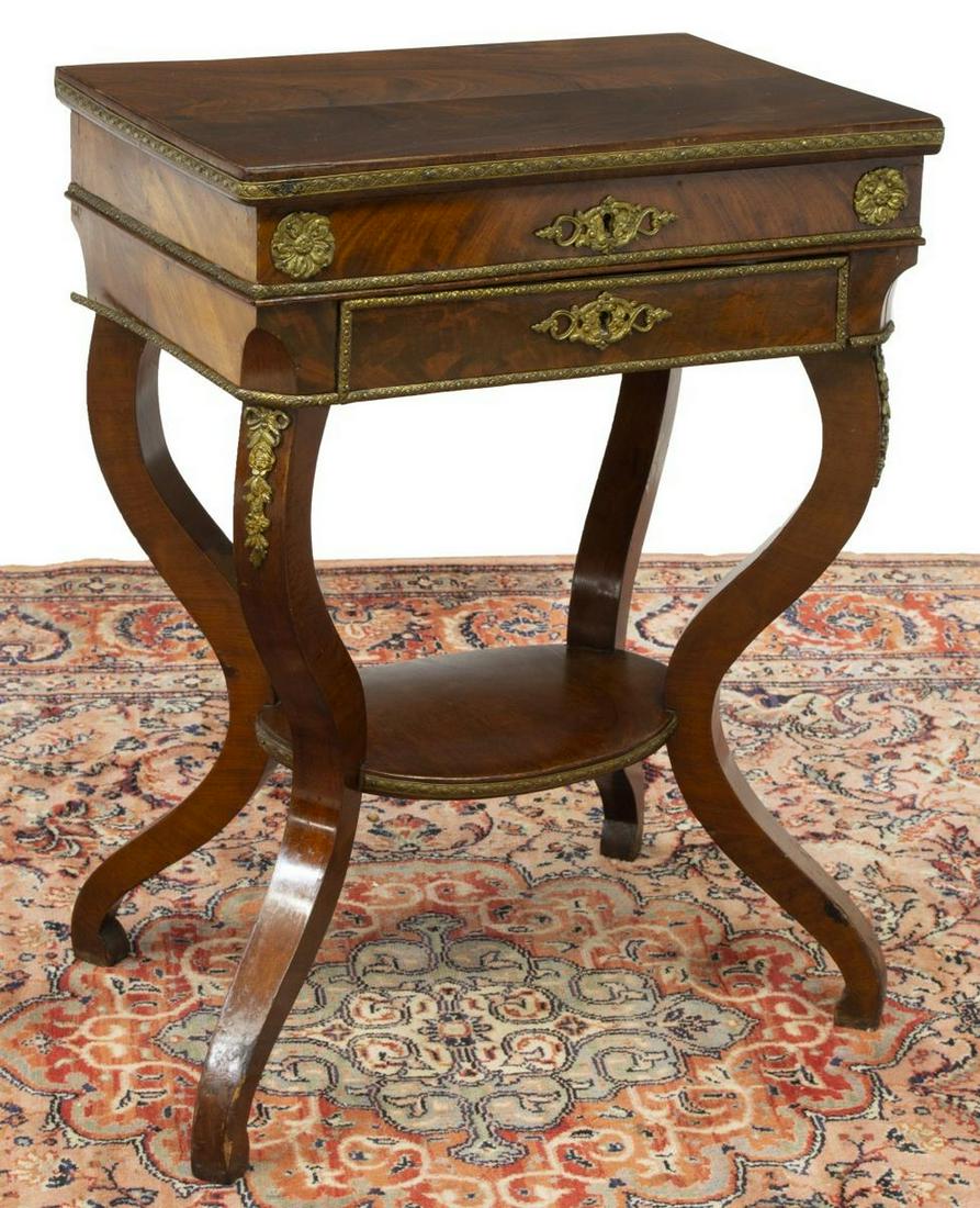 FRENCH CHARLES X MAHOGANY TRAVAILLEUSE: French Charles X mahogany sewing or work table, 19th c., having a rectangular top, opening to reveal a sectioned interior, with inset mirror, exterior drawer over an oval-shaped medial shelf, having g