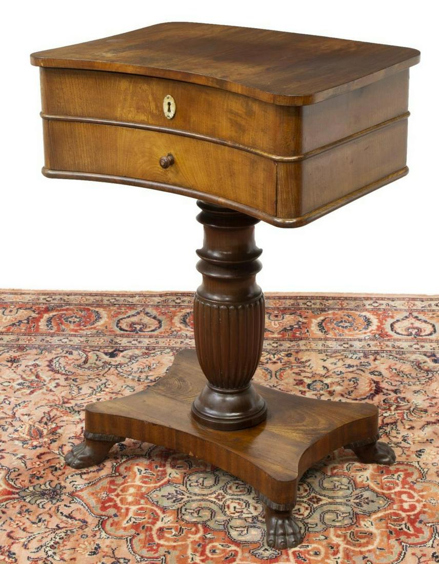 EMPIRE STYLE MAHOGANY FITTED SEWING STAND: Empire style mahogany sewing stand, 19th c., hinged top opening to fitted interior with small compartments, single frieze drawer, ribbed center pedestal, shaped platform base further raised on carved 