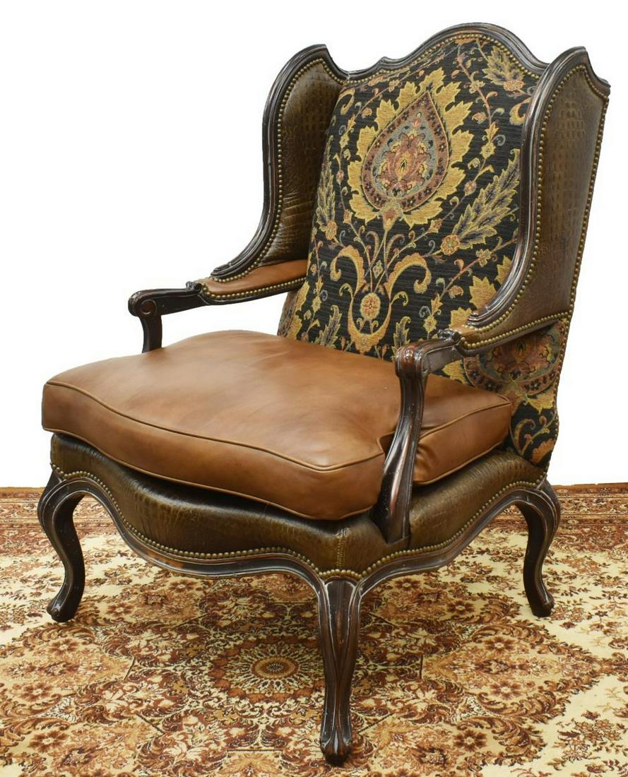 OVERSIZED LEATHER & UPHOLSTERED WINGBACK CHAIR: Oversized leather and upholstery wingback chair, Our House Designs, Inc., Hickory, North Carolina, having crocodile embossed leather to wings, floral patterned upholstery over leather cushioned seat,