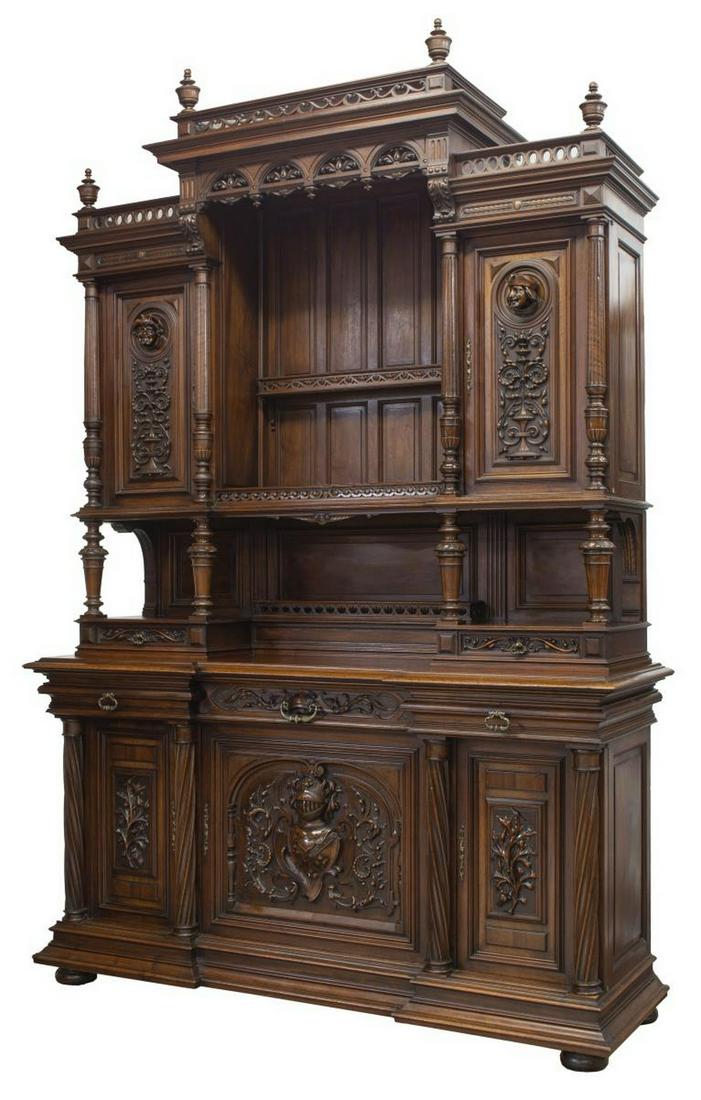 MONUMENTAL RENAISSANCE REVIVAL WALNUT SIDEBOARD: French Renaissance Revival walnut sideboard, late 19th c., super structure with turned finials, over pierced railings, center plate rail and display shelf, flanked by cabinets with projecting masks, t