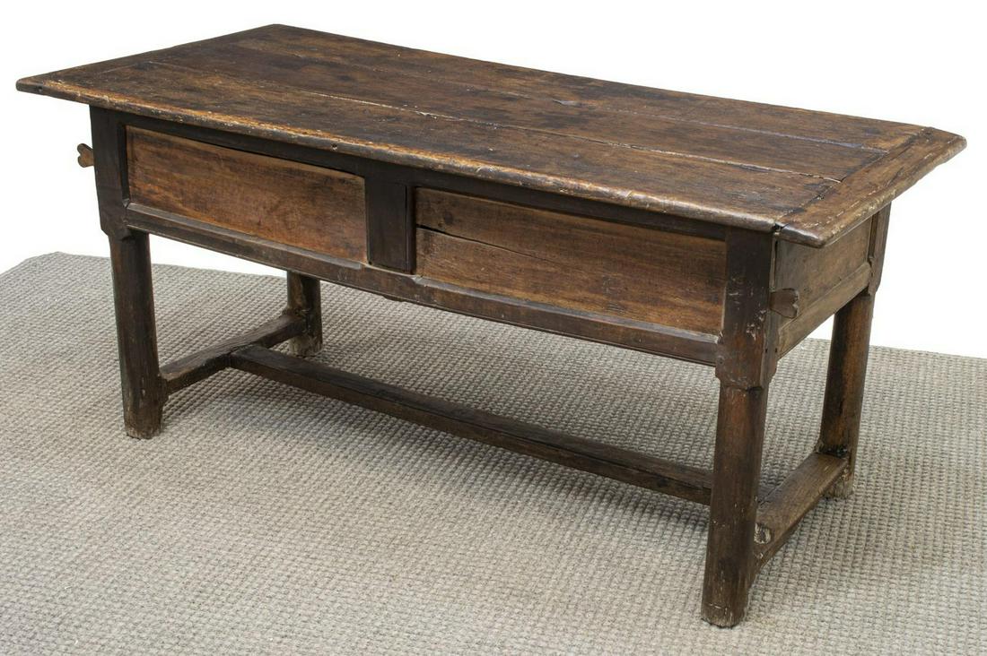 FRENCH OAK PLANK-TOP FARMHOUSE TABLE, EARLY 19TH C: French oak farmhouse table, early 19th c., having a rectangular plank top, over sliding panels that open to storage on one side, hewn legs joined by H stretcher, approx 28"h, 62.75"l, 14.5"w Start Pri