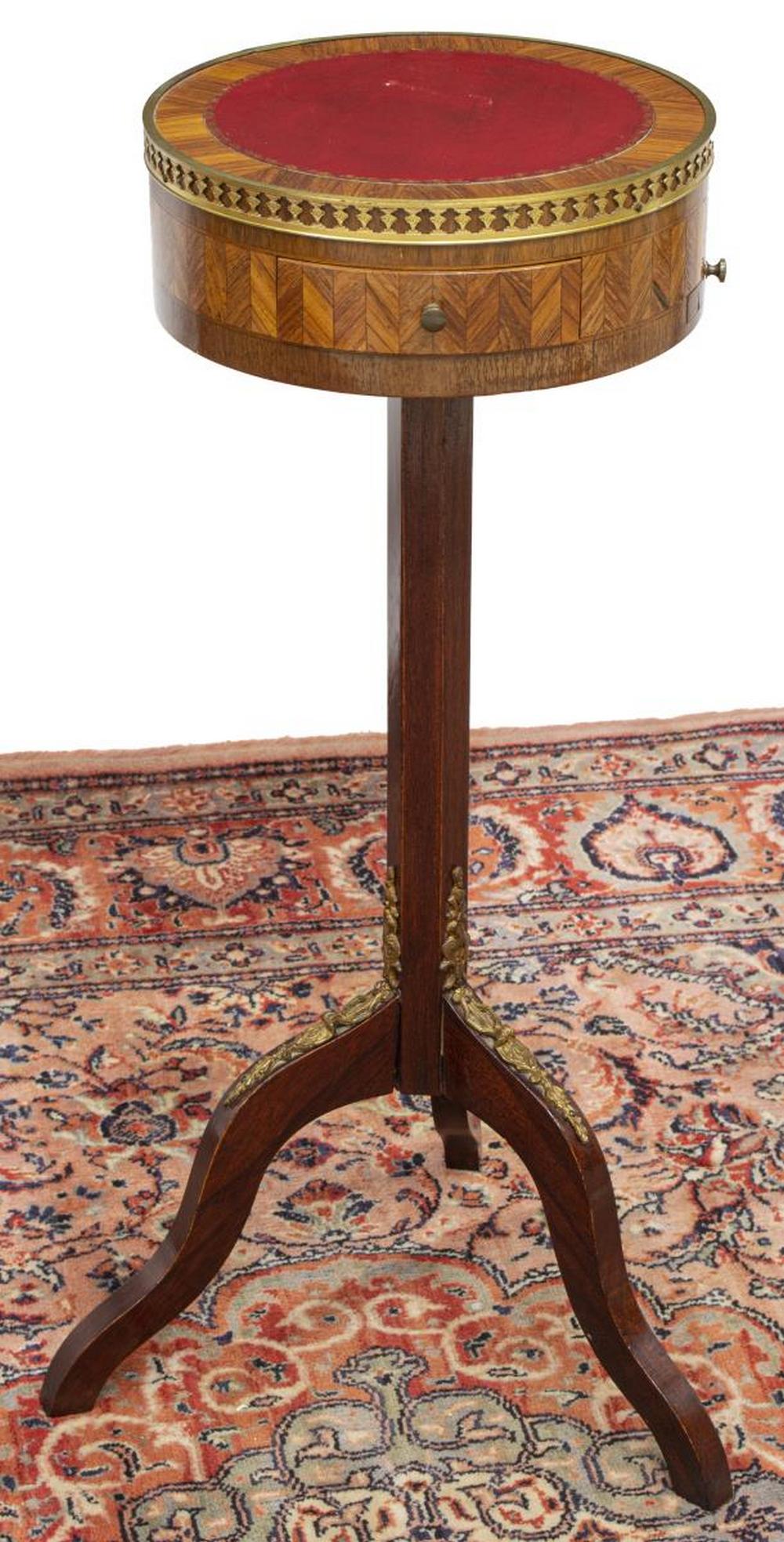 FRENCH LEATHER-TOP MAHOGANY STAND: French mahogany stand, early 20th c., circular top with inset leather surface, parquetry apron with single drawer, pull-out leather slide, hexagonal center pedestal, on three scrolled legs with gilt m