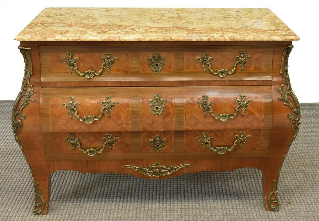FRENCH LOUIS XV STYLE MARBLE-TOP PARQUETRY COMMODE: French Louis XV style mahogany commode en tombeau, 20th c., marble top with molded edge, over three parquetry-accented drawers, gilt metal case mounts and pulls, rising on French bracket feet, approx 
