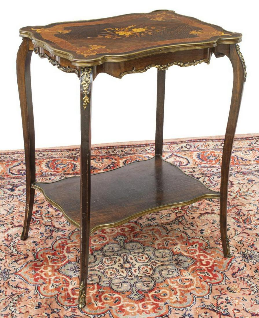 LOUIS XV STYLE MAHOGANY MARQUETRY SIDE TABLE: French Louis XV style mahogany stand/ side table, 19th c., having shaped top, marquetry inlay and matched veneers, medial shelf, bronze foliate accents, rising on cabriole legs, terminating in metal m