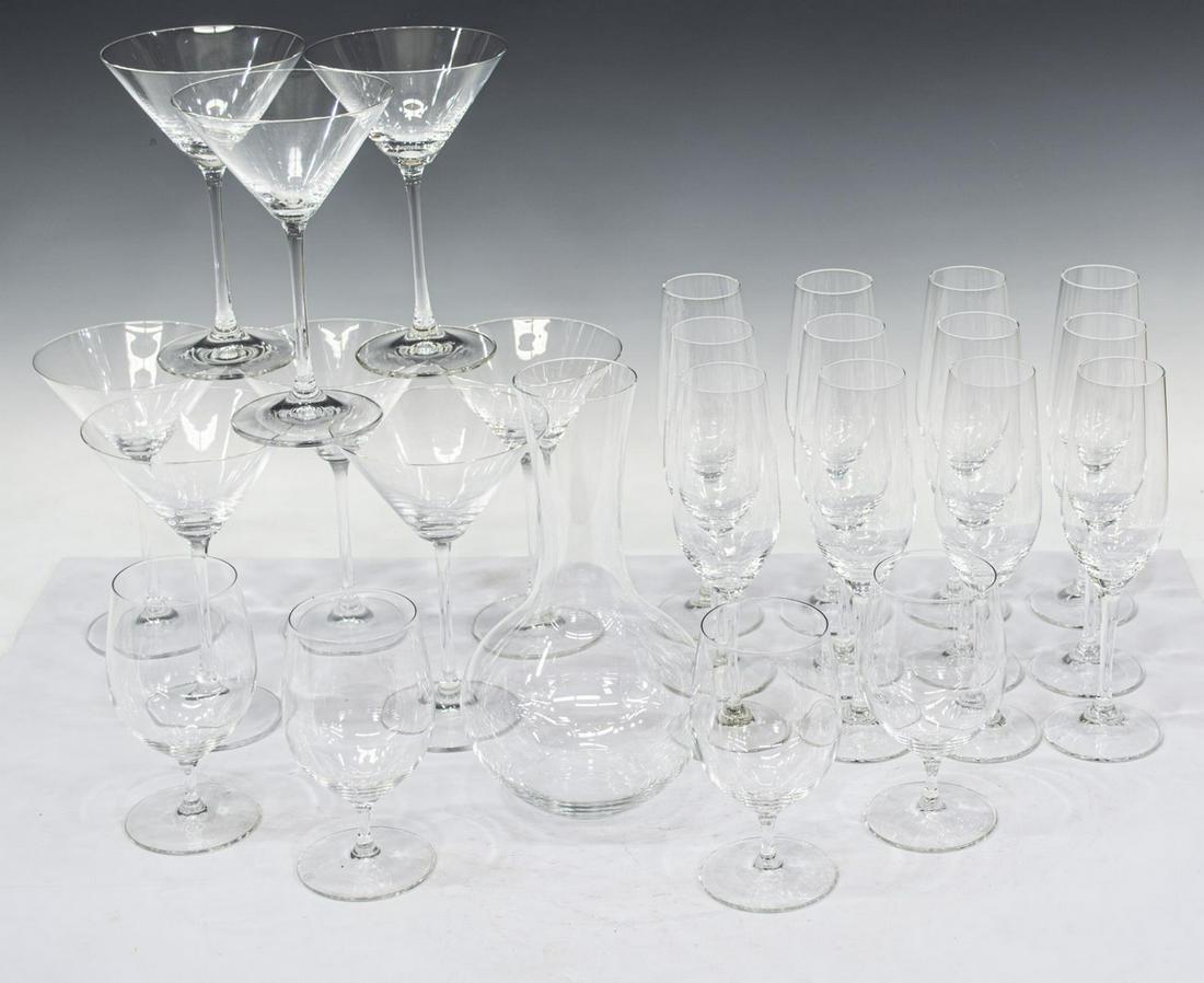 (25) RIEDEL COLORLESS GLASS STEMWARE & DECANTER: (lot of 25) Riedel colorless glass stemware and decanter, all with acid-etched mark underfoot, including: (1) open decanter, approx 10"h; (4) water goblets, approx 6"h, 2.5"diam; (8) martini glasses, 