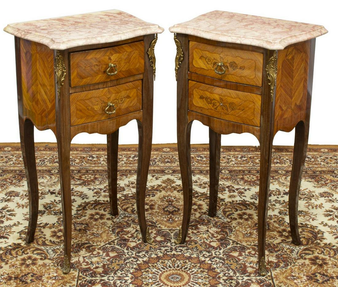(2) FRENCH LOUIS XV STYLE MARBLE-TOP NIGHTSTANDS: (pair) French Louis XV style marble-top nightstands, 20th c., each having molded marble top, over two drawer case with matched veneer and metal mounts, floral marquetry, lacking one drop pull, approx 