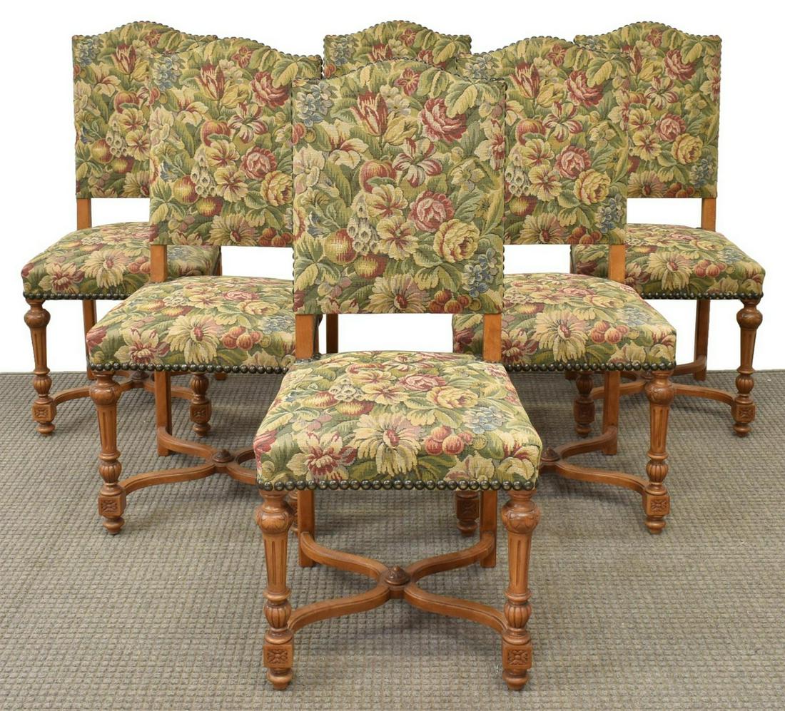 (6) FRENCH HENRI II STYLE UPHOLSTERED SIDE CHAIRS: (lot of 6) French Henri II style carved walnut side chairs, late 19th/ early 20th c., having floral tapestry affixed by large nailheads, on stretcher-joined base with fluted front legs, approx 41.5"h,
