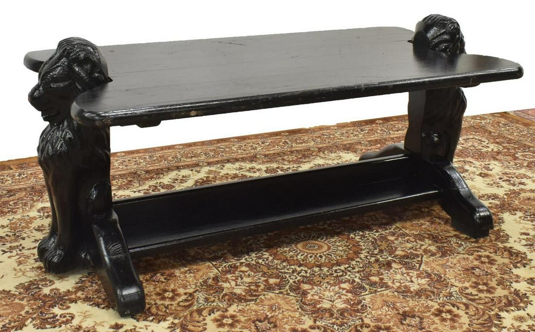 FRENCH FIGURAL LION CARVED WOOD TABLE: French figural carved wood table, painted black, with shaped top, lion-form trestle base joined by low medial shelf, loss to paint/ chipping to top, approx 23"h, 50"w, 24"d Start Price: $150.00