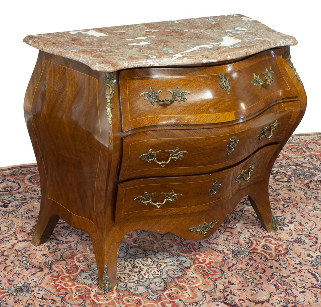 LOUIS XV STYLE MARBLE-TOP BOMBE COMMODE: Louis XV style bombe commode, mid 20th c., having a shaped marble top, diamond matched mahogany veneers, fitted with three drawers, scalloped apron, rising on French bracket feet, ending in sabots, ve