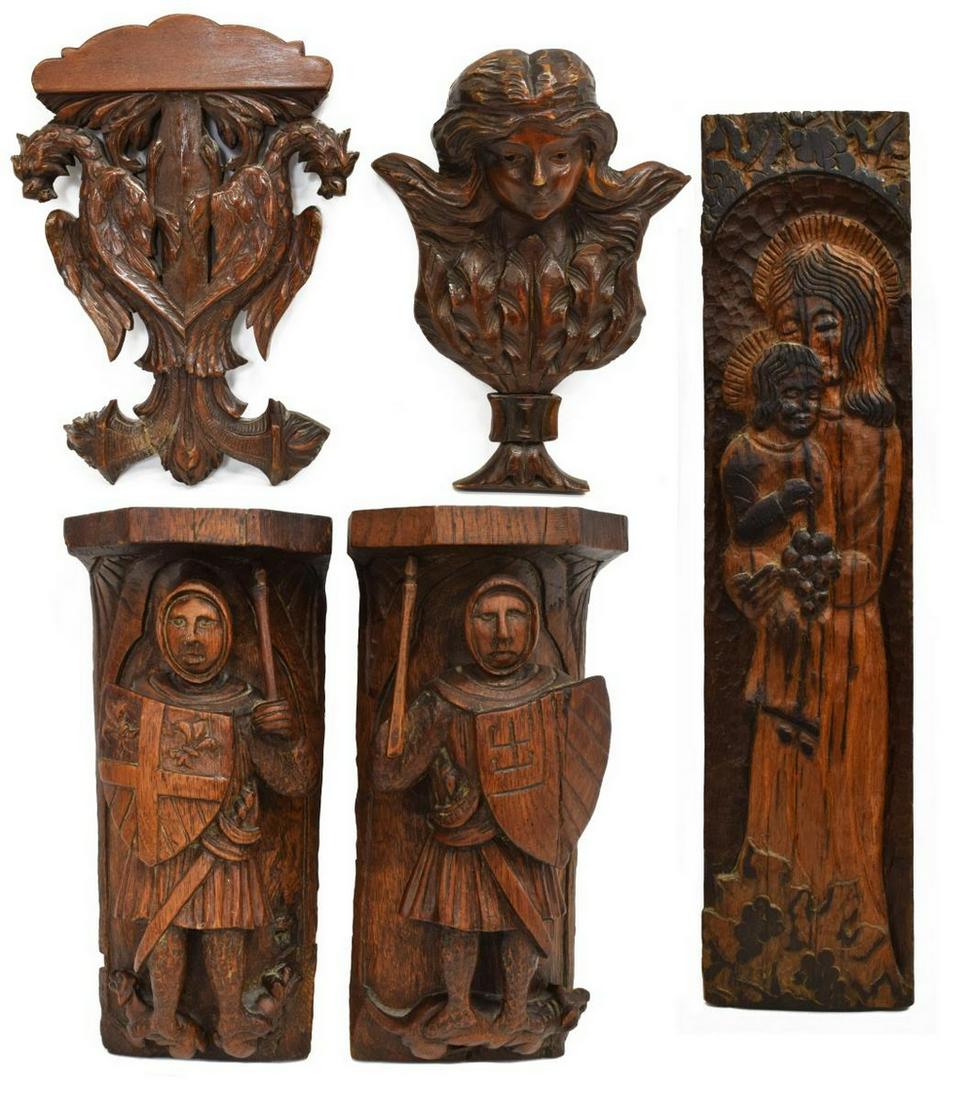 (5) CARVED ANTIQUE FRENCH ARCHITECTURAL ELEMENTS: (lot of 5) French carved oak and walnut architectural wall elements, 19th c., comprising: (1) open-carved, depicting two griffins, approx 15"h, 11"w; (1) figural head over foliates, approx 13.5"h, 11"