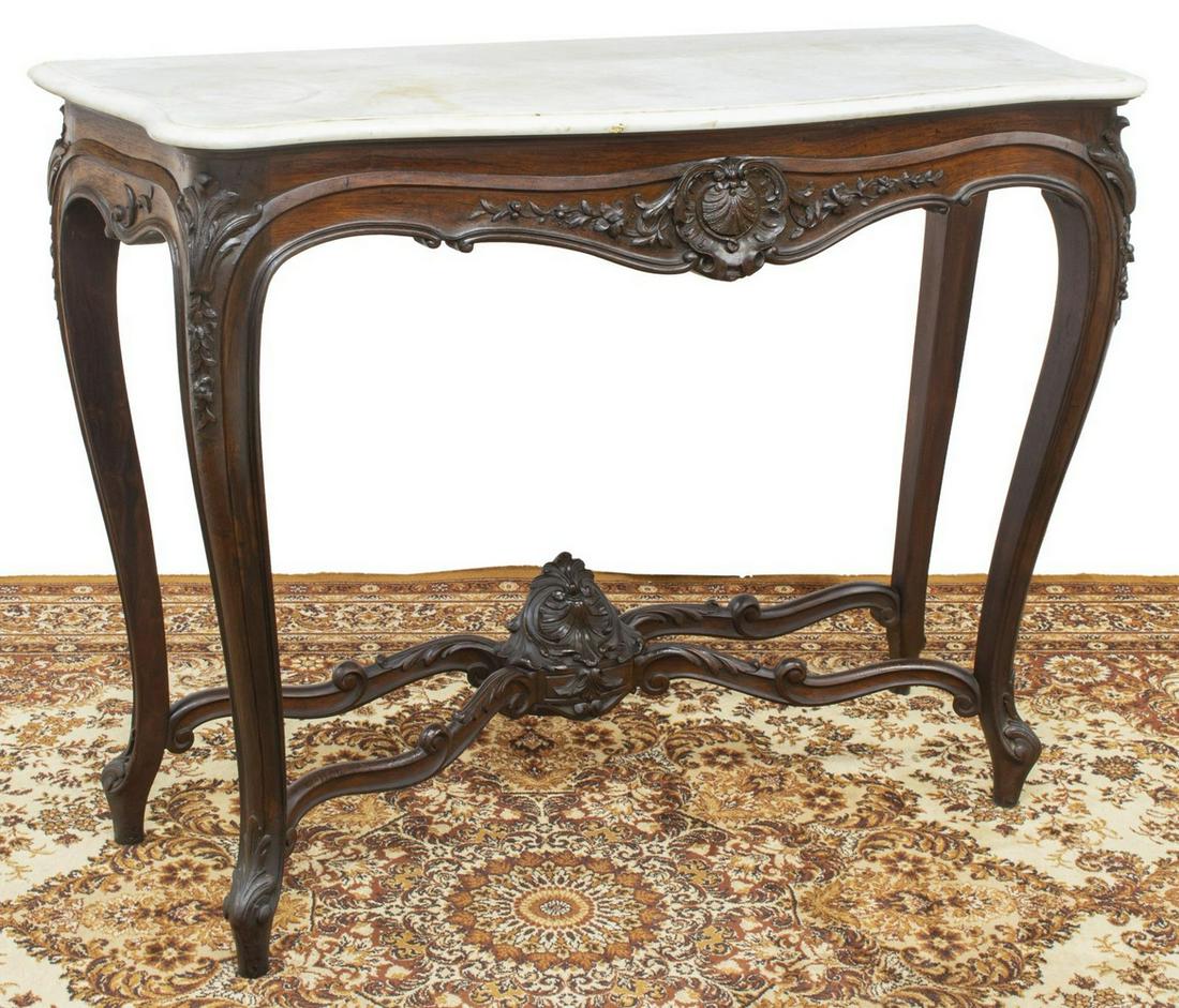 LOUIS XV STYLE MARBLE-TOP MAHOGANY CONSOLE: French Louis XV style marble-top mahogany console table, 19th c., shaped top, scalloped foliate carving throughout, rising on stretcher-joined cabriole legs, approx 38.5"h, 51.25"w, 20"d Start Price: 