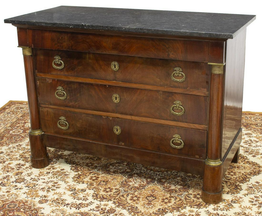 FRENCH EMPIRE STYLE MARBLE-TOP MAHOGANY COMMODE: French Empire style mahogany commode, 19th c., rectangular marble top, over case fitted with one frieze drawer, three lower drawers, gilt foliate escutcheon and hanging pulls, flanked by cylindrical c