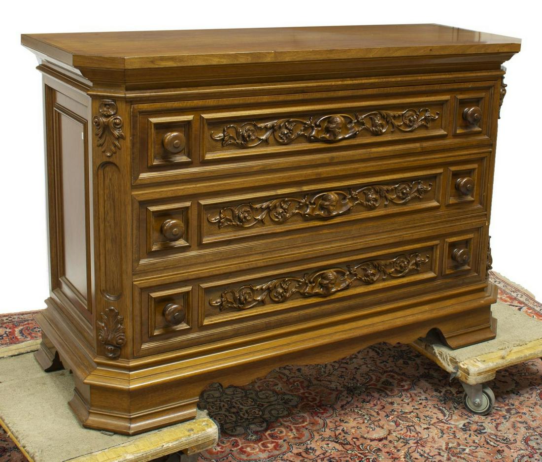 ITALIAN RENAISSANCE STYLE WALNUT 3-DRAWER COMMMODE: Italian Renaissance style walnut commode, late 20th c., three drawers with turned pulls, relief panels with female masks, scrolling foliates, rising on canted bracket feet, approx 37.75"h, 55.75"w, 21