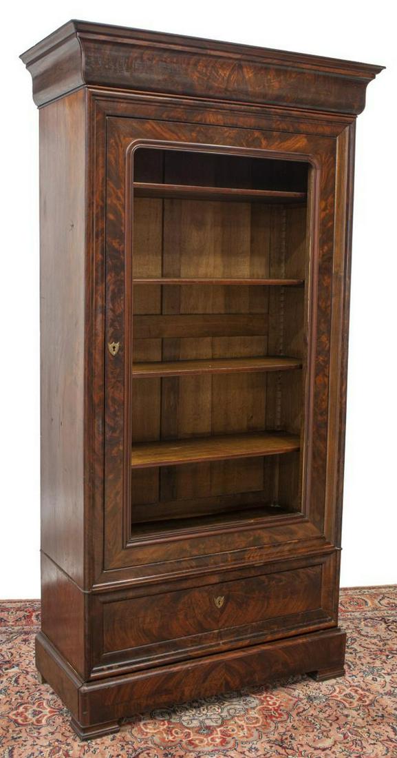 FRENCH LOUIS PHILIPPE MAHOGANY SINGLE-DOOR ARMOIRE: French Louis Philippe period mahogany armoire, mid 19th c., ogee-molded cornice, single door, lacking glass or mirror inset, interior shelves, two exterior drawers below, lowest concealed in molding, 