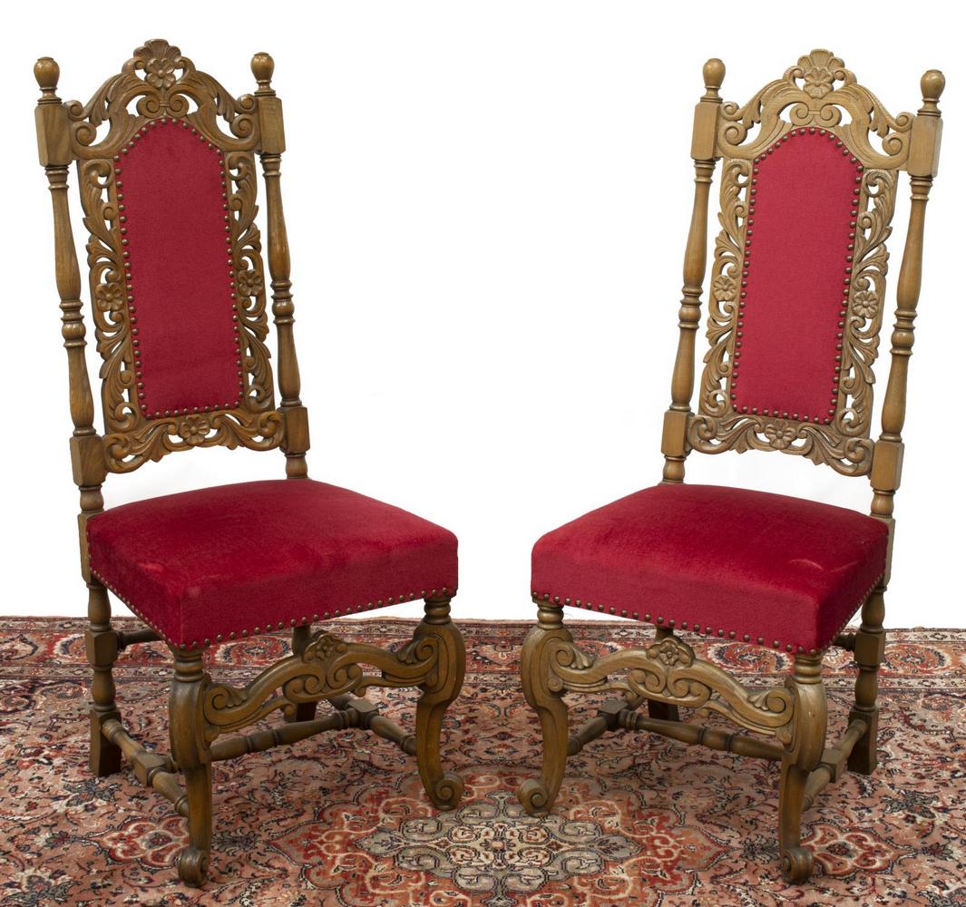 (2) RENAISSANCE REVIVAL CARVED WALNUT CHAIRS: (pair) Renaissance Revival chairs, 20th c., each having open-carved foliates throughout, red upholstered back and seat, turned supports, stretcher-joined cabriole legs, terminating in whorl feet to fr