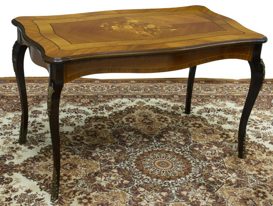 LOUIS XV STYLE MARQUETRY COFFEE TABLE: Louis XV style coffee table, mid 20th c., shaped top with central floral marquetry, rising on cabriole legs, with gilt metal foliate mounts, approx 24"h, 39.5"w, 23"d Start Price: $100.00