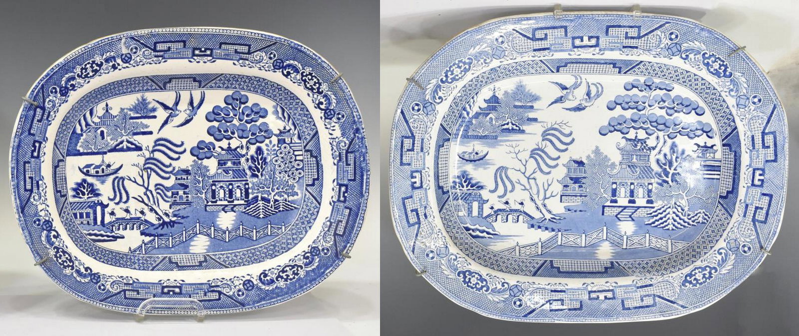 (2) ENGLISH BLUE WILLOW SERVING PLATTERS: (lot of 2) English blue & white transferware serving platters, in the Blue Willow pattern, early 20th c., having diaper pattern border, central landscape scene with pagoda and foliates, crazing, (1) a