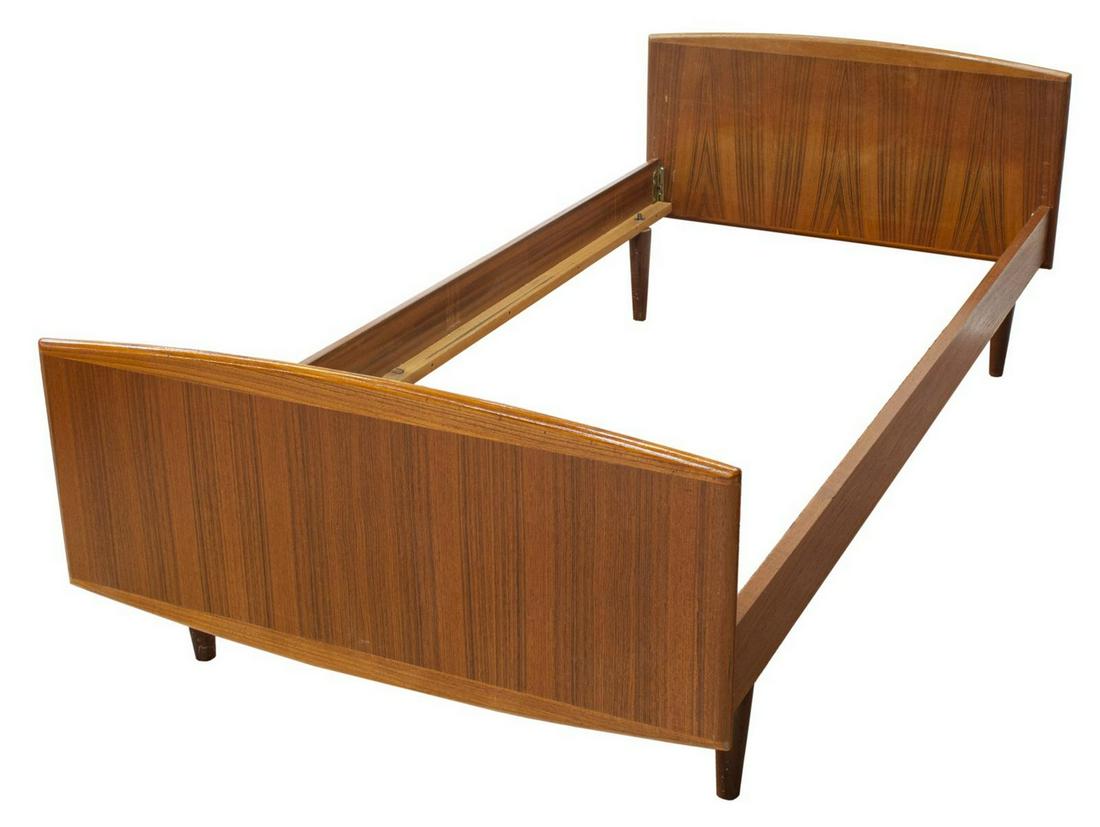 DANISH MID-CENTURY MODERN TEAK BED: Danish mid-century modern teakwood bed, c.1950s, having solid head and footboard, on tapered legs, tonal variation to head and footboard, exterior: approx 25"h, 36"w, 76.5"d, interior: approx 34"w, 75