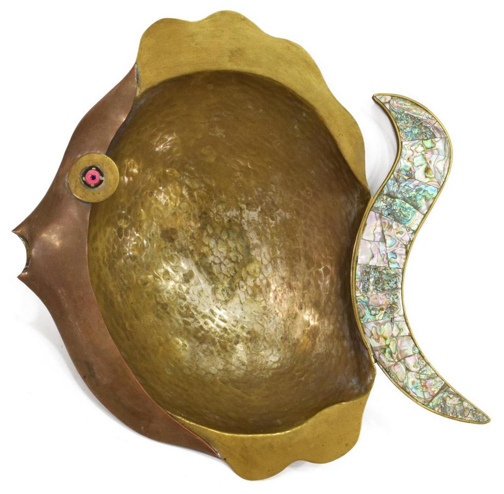 TLAQUEPARTE MIXED METAL & ABALONE FISH-FORM BOWL: Mixed media fish-form bowl, c.1970s, Mexico, having hammered brass body, with copper face, red and blue glass eye, abalone shell inlay to tail, rising on round ball feet, marked Tlaqueparte F.C.S unde