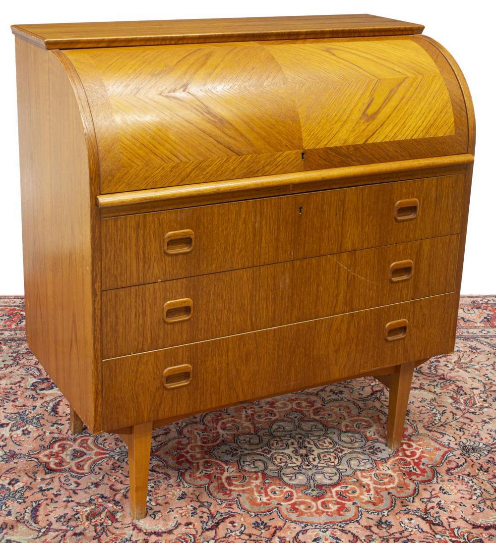 DANISH MID-CENTURY MODERN TEAK BUREAU DESK: Danish mid-century modern teak bureau, c.1950s, cylinder top, interior fitted with shelves and drawers, over pull-out writing surface, above three drawers, rising on tapered legs, approx 38.5"h, 35.5"