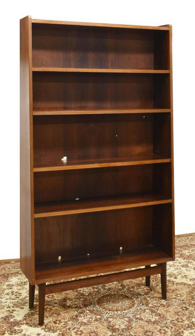 DANISH MID-CENTURY MODERN ROSEWOOD BOOKCASE: Danish mid-century modern rosewood bookcase, c.1960s, having four adjustable height shelves, rising on tapered legs, approx 72"h, 39.5"w, 11"d Start Price: $250.00