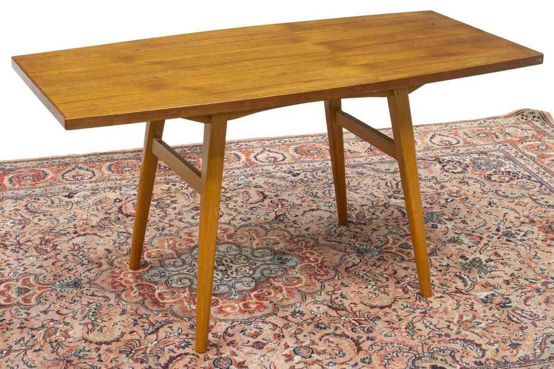 DANISH MID-CENTURY MODERN TEAK COFFEE TABLE: Danish mid-century modern teakwood coffee table, c.1950s, having a shaped top, rising on stretcher-joined tapered legs, approx 24.25"h, 47"w, 22.5"d Start Price: $100.00