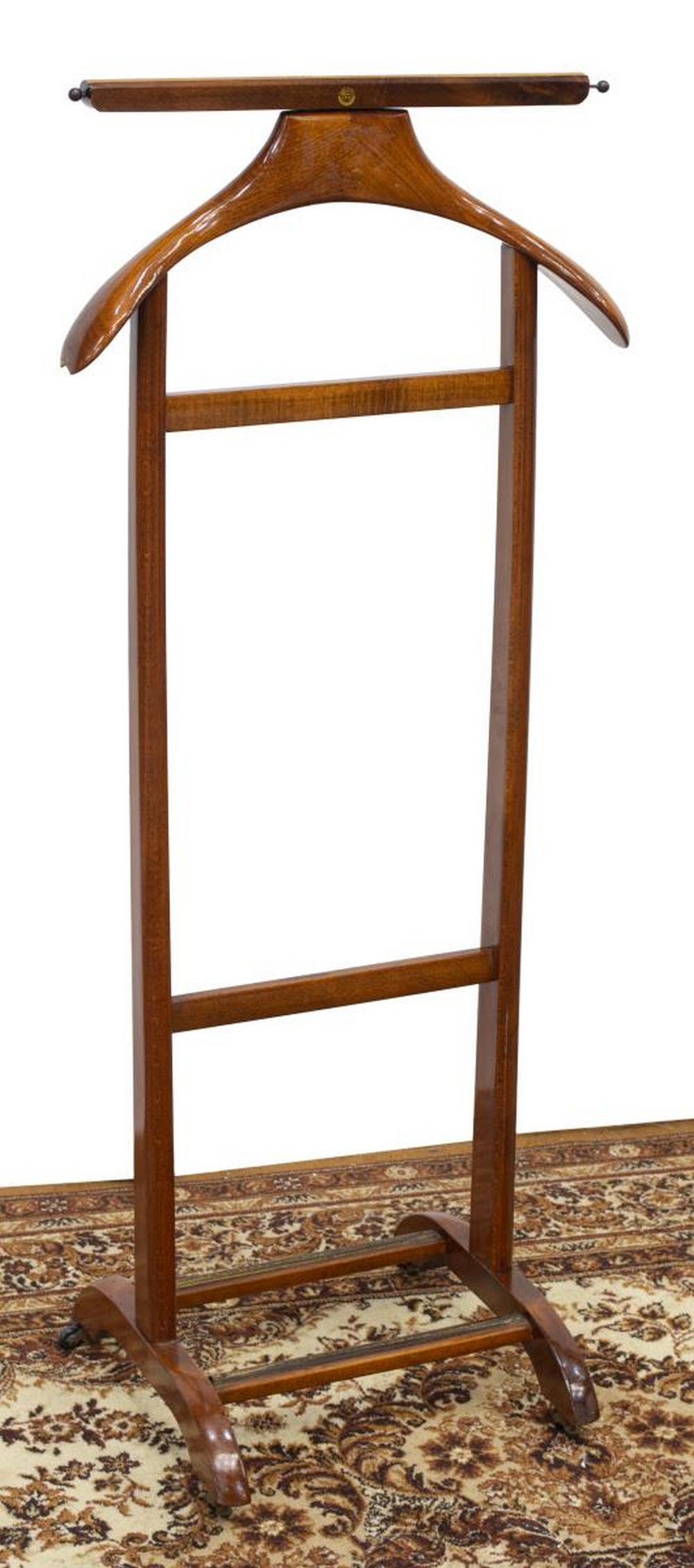 ITALIAN FRATELLI REGUITTI MID-CENTURY MODERN VALET: Italian mid-century modern gentleman's valet, Fratelli Reguitti, c.1960s, with jacket hanger and pants rail, moving on casters, loss to one side of jacket hanger, approx 42"h, 17.5"w, 14"d Start Price