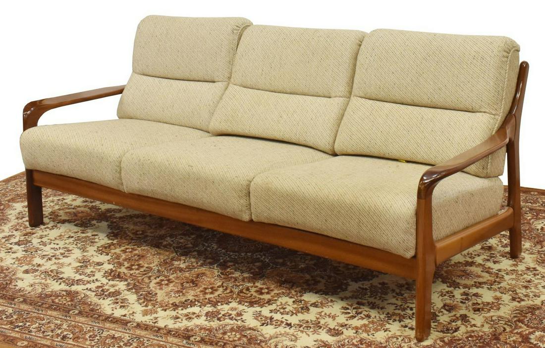DANISH MID-CENTURY MODERN 3-SEAT TEAK FRAME SOFA: Danish mid-century modern three-seater sofa, c.1960s, having teak frame, with ladder back, tan upholstered removable back and seat cushions, approx 31"h, 74"w, 32"d Start Price: $250.00