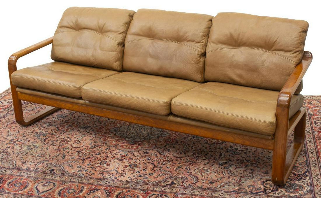 DANISH MID-CENTURY MODERN 3-SEAT TEAK FRAME SOFA: Danish mid-century modern teak sofa, c.1960s-1970s, bentwood frame, having leather upholstered removable back and seat cushions, approx 31.75"h, 76.5"w, 26"d Start Price: $250.00