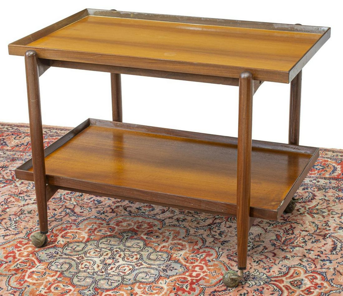 ITALIAN MID-CENTURY MODERN TWO-TIER SERVICE CART: Italian mid-century modern teak service cart, c.1960s, fitted with two rectangular trays, tapered supports, on casters, approx 23.5"h, 30.5"w, 17.75"d Start Price: $100.00