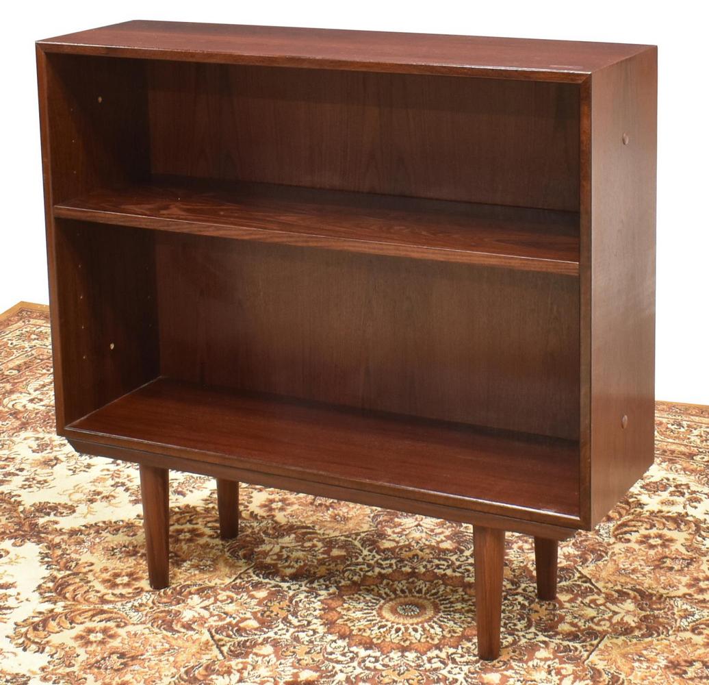 DANISH DYRLUND MID-CENTURY MODERN BOOKCASE: Danish mid-century modern bookcase, Hjernebo System by Dyrlund, c.1960s, having two shelves, rising on tapered legs, approx 32.5"h, 33.75"w, 10.25"d Start Price: $100.00