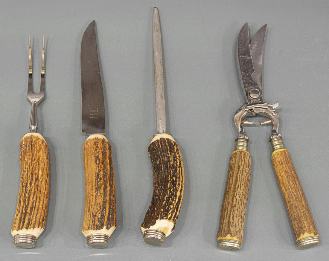 (4) GERMAN STAG HANDLE CARVING SET: (lot of 4) Stag handle German carving set: (1) carving knife, 11"l; (1) fork, 10"l; (1) sharpening rod, 10"l; (1) scissors, 11"l Start Price: $60.00