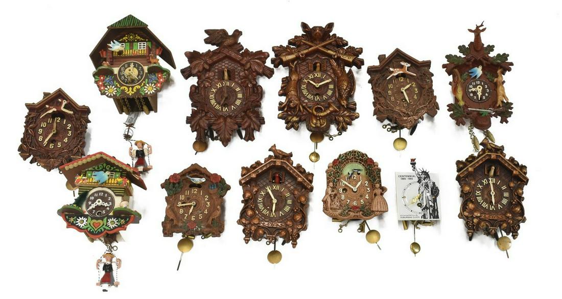 (12) KEEBLER & WATERBURY MINIATURE CUCKOO CLOCKS: (lot of 12) Collection of miniature cuckoo clocks, 20thc., of varied size and similar form, each having time only movement, with carved wood case, featuring birds, woodland animals, figures and foliat