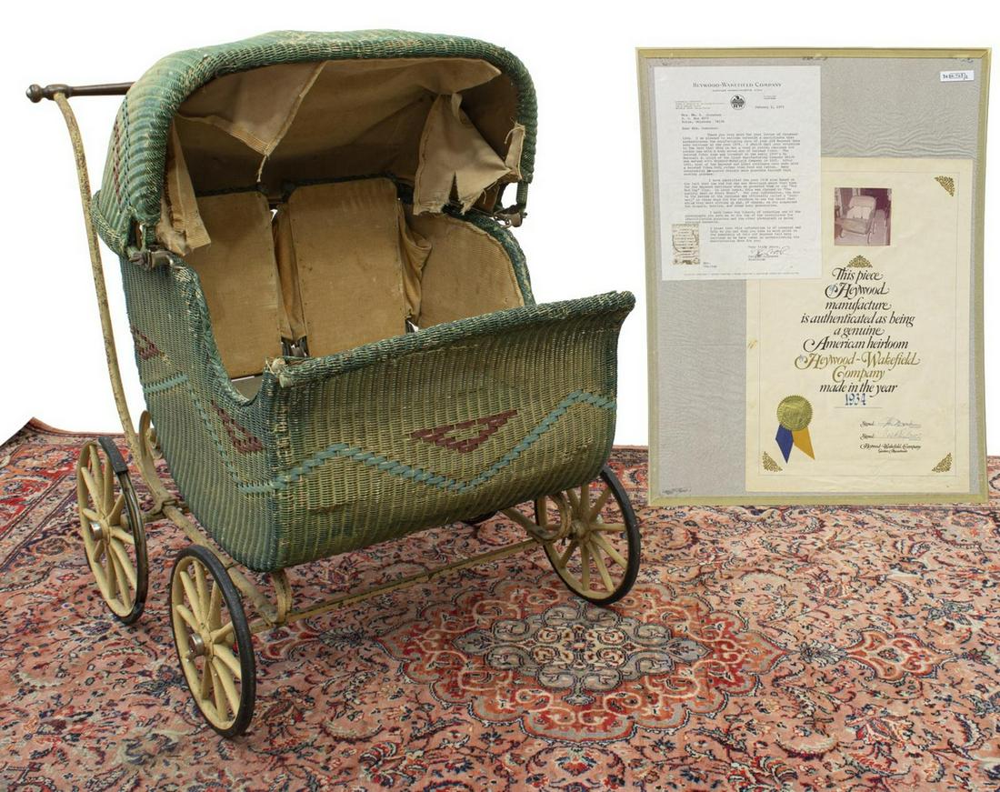 1934 HEYWOOD-WAKEFIELD TWIN BABY CARRIAGE: Heywood-Wakefield Twin Baby Carriage, c.1934, woven twisted fiber having a rattan look and worn paint, a retractable top, interior adjustable back supports, two foot wells that may be used for storage