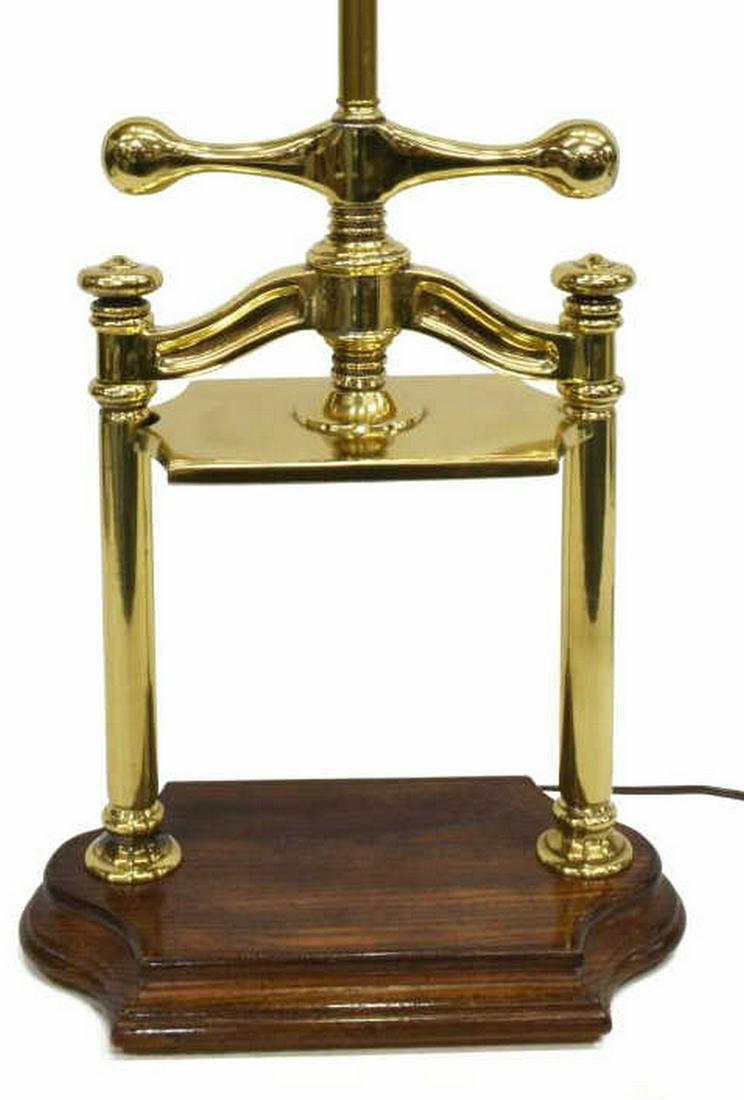 KNOB CREEK GILT METAL FAUX BOOK PRESS TABLE LAMP: Knob Creek gilt metal table lamp, last quarter 20th c., single-light, over base modeled as a faux book press, rising on shaped wood base, approx 22.5"h, 14"w, 8"d, 9.25lbs Start Price: $50.00
