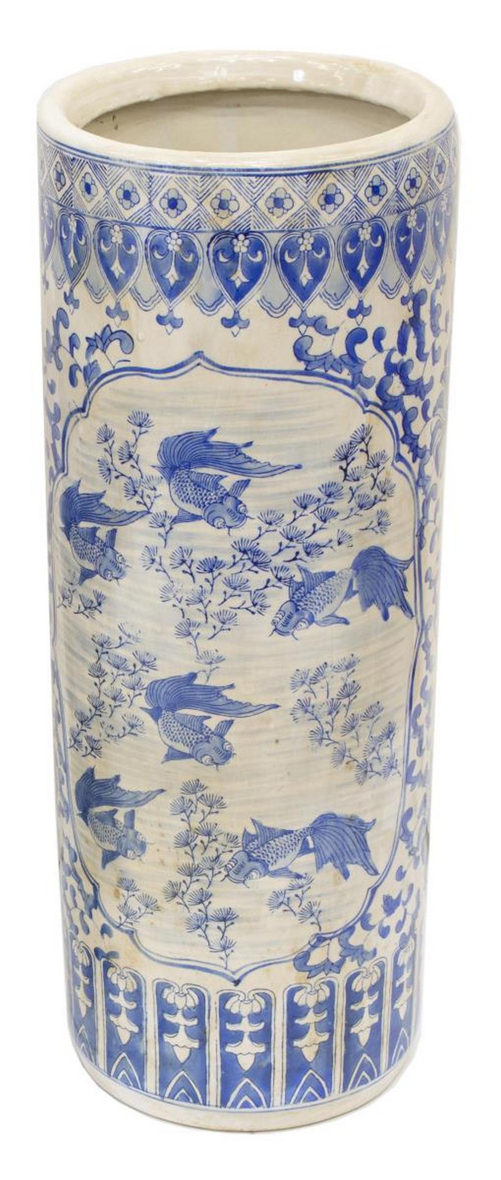 CHINESE BLUE & WHITE PORCELAIN UMBRELLA STAND: Chinese blue and white porcelain umbrella stand, having scrolled foliates, registers centering fish motifs, yellowing to porcelain, approx 25"h, 9.25"diam, 15lbs Start Price: $60.00