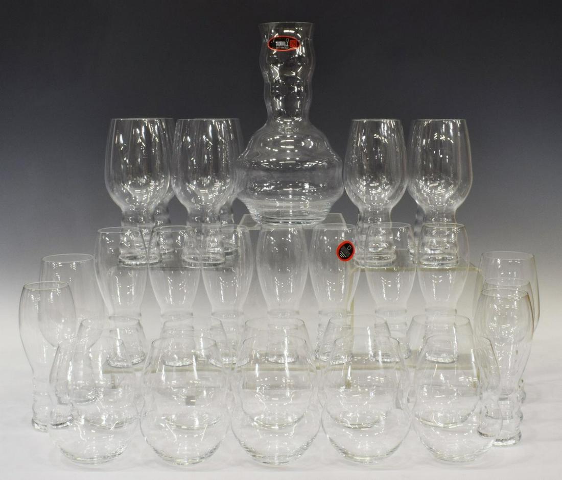 31) RIEDEL SWIRL COLORLESS WINE GLASSES & DECANTER: (lot of 31) Riedel "Swirl" colorless wine glasses and decanter, all with acid etched mark underfoot, comprising: (8) stemless red wine, approx 4.75"h, 3.75"diam; (10) red/white wine, having subtle cur