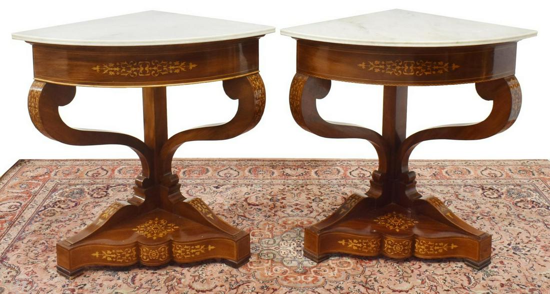 (2) MARBLE-TOP MAHOGANY MARQUETRY CORNER CONSOLES: (lot of 2) Mahogany corner console tables, early 20th c., marble top with molded front edge, frame with contrasting marquetry, scrolled corbel supports, serpentine-front platform base, further raised