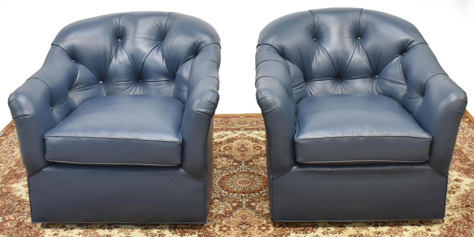 (2) BLUE LEATHER UPHOLSTERED SWIVEL LOUNGE CHAIRS (1 of 2)